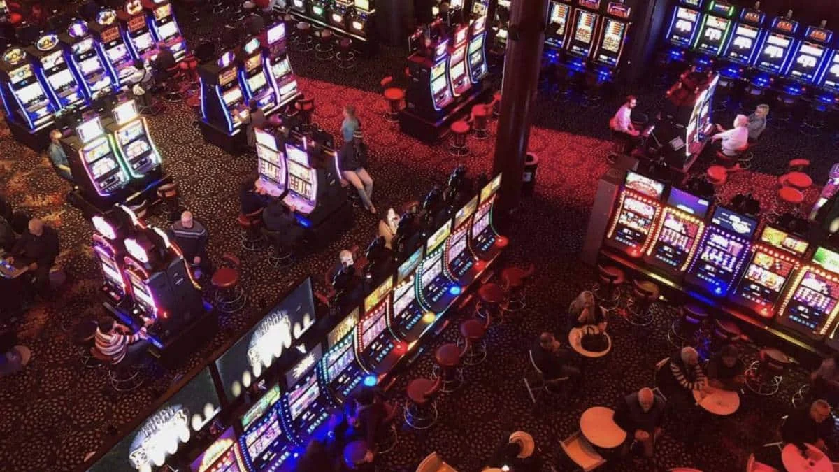 Slot machines on a busy Pennsylvania casino floor with players gambling