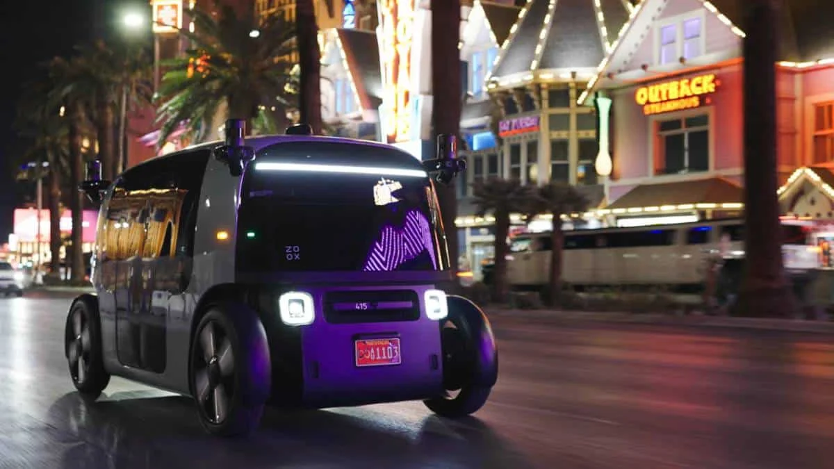 Zoox autonomous vehicle driving along the Las Vegas Strip at night