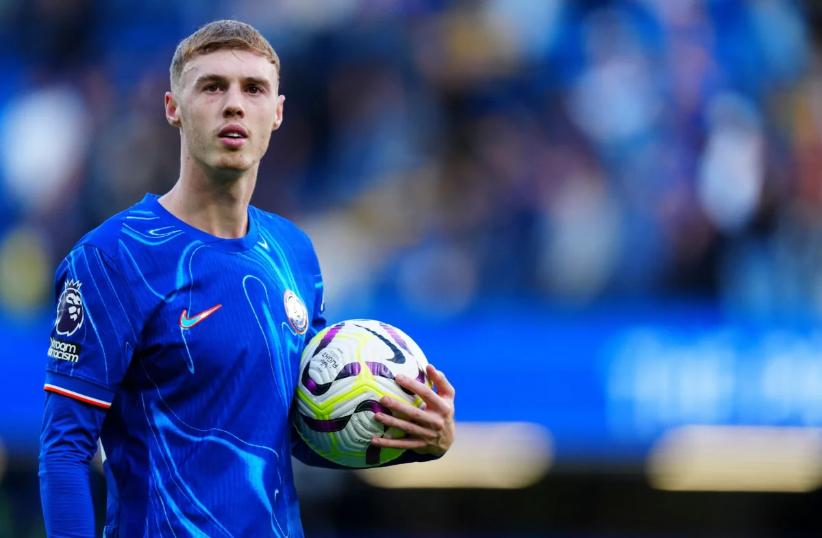 Palmer celebrates with the match ball after scoring four goals in the match against Brighton.