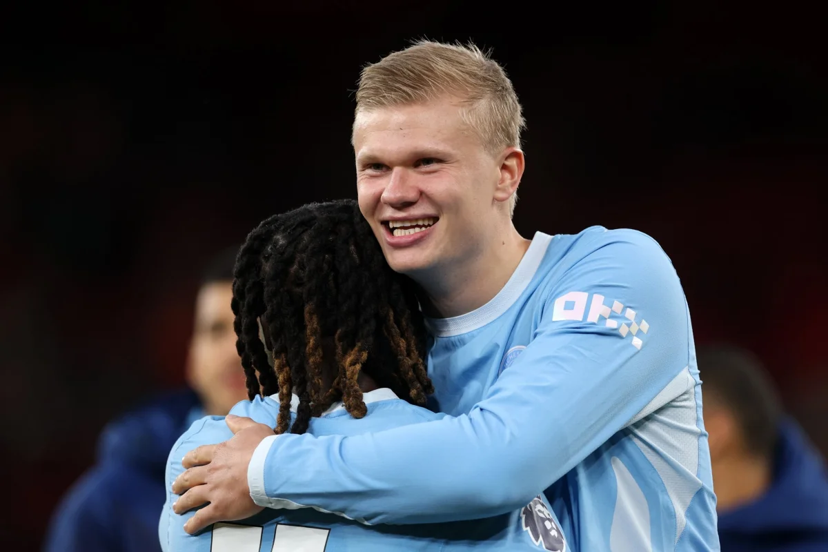 LIVERPOOL, ENGLAND - OCTOBER 11: Erling Haaland of Manchester City celebrates with team mate Jeremy Doku after victory in the Premier League 2026/27 match between Liverpool FC and Manchester City at Anfield on October 11, 2026 in Liverpool, England. (Photo by Michael Regan/Getty Images)