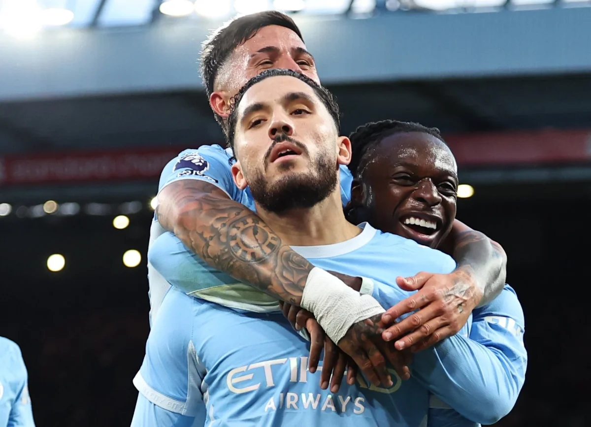 LIVERPOOL, ENGLAND - OCTOBER 11: Rayan Cherki of Manchester City celebrates scoring their third goal with Jeremy Doku, Enzo Fernandez during the Premier League 2026/27 match between Liverpool FC and Manchester City at Anfield on October 11, 2026 in Liverpool, England. (Photo by Robbie Jay Barratt - AMA/Getty Images) *** BESTPIX ***