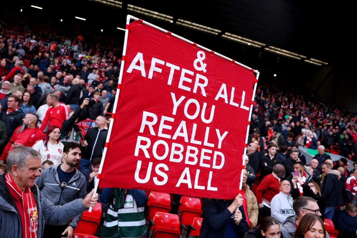 LIVERPOOL, ENGLAND - OCTOBER 11: Liverpool fans display a banner that reads "& after all, you really robbed us all" before the Premier League 2026/27 match between Liverpool FC and Manchester City at Anfield on October 11, 2026 in Liverpool, England. (Photo by Alex Pantling/Getty Images) *** BESTPIX ***