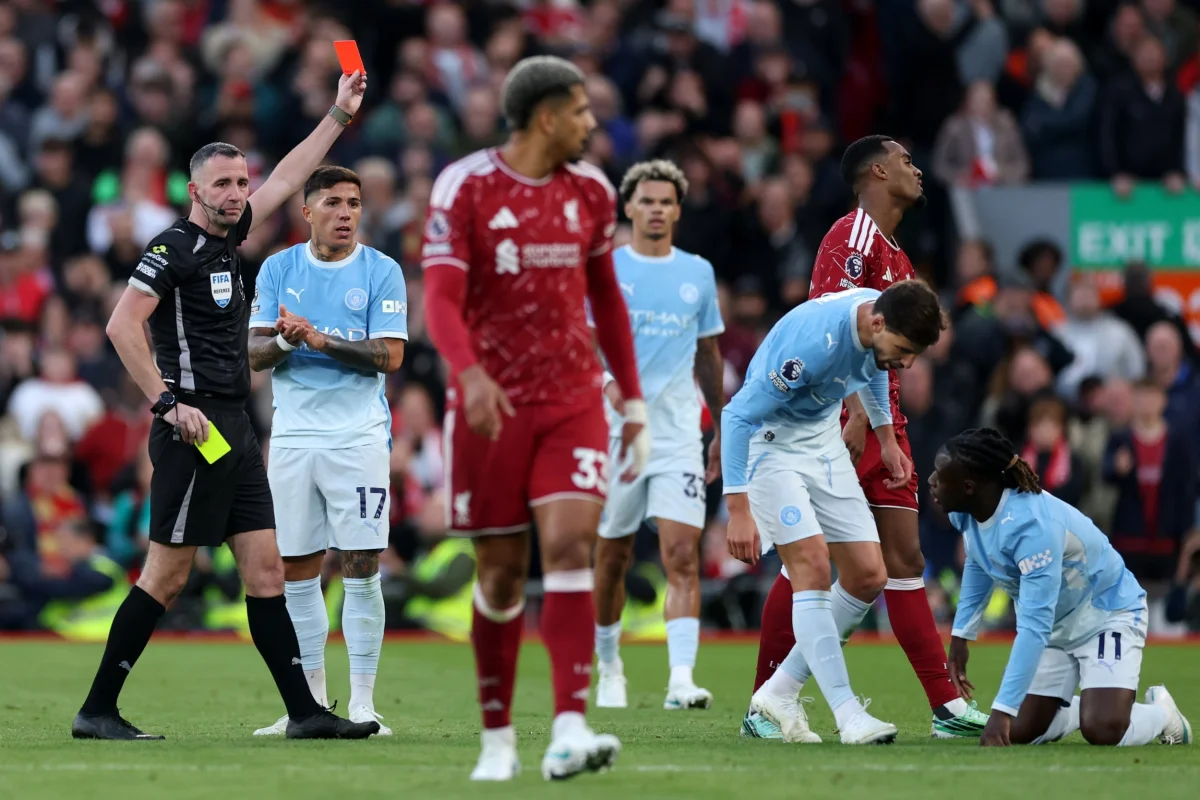 LIVERPOOL, ENGLAND - OCTOBER 11: Ryan Gravenberch of Liverpool receives a red card from referee Chris Kavanagh after getting a second yellow card during the Premier League 2026/27 match between Liverpool FC and Manchester City at Anfield on October 11, 2026 in Liverpool, England. (Photo by Michael Regan/Getty Images)