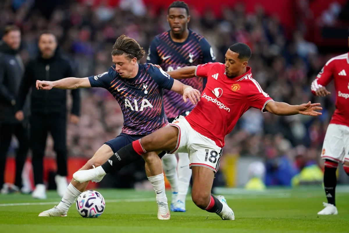 Manchester United's Youri Tielemans and Tottenham's Conor Gallagher, left, during the English Premier League soccer match between Manchester United and Tottenham Hotspur in Manchester, England, Saturday, Oct. 10, 2026. (AP Photo/Dave Thompson)